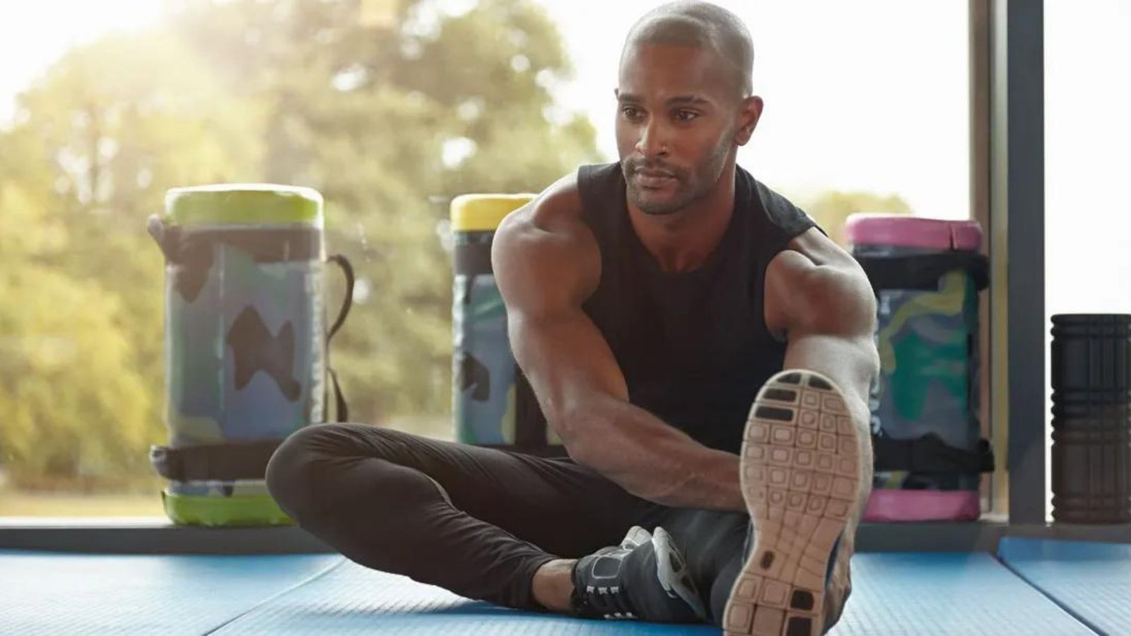 A man practicing a Healthy Post-Event Stretching Routine